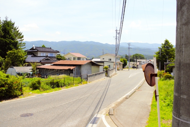 A quiet street in Minowa Town with the Nagano mountains beyond